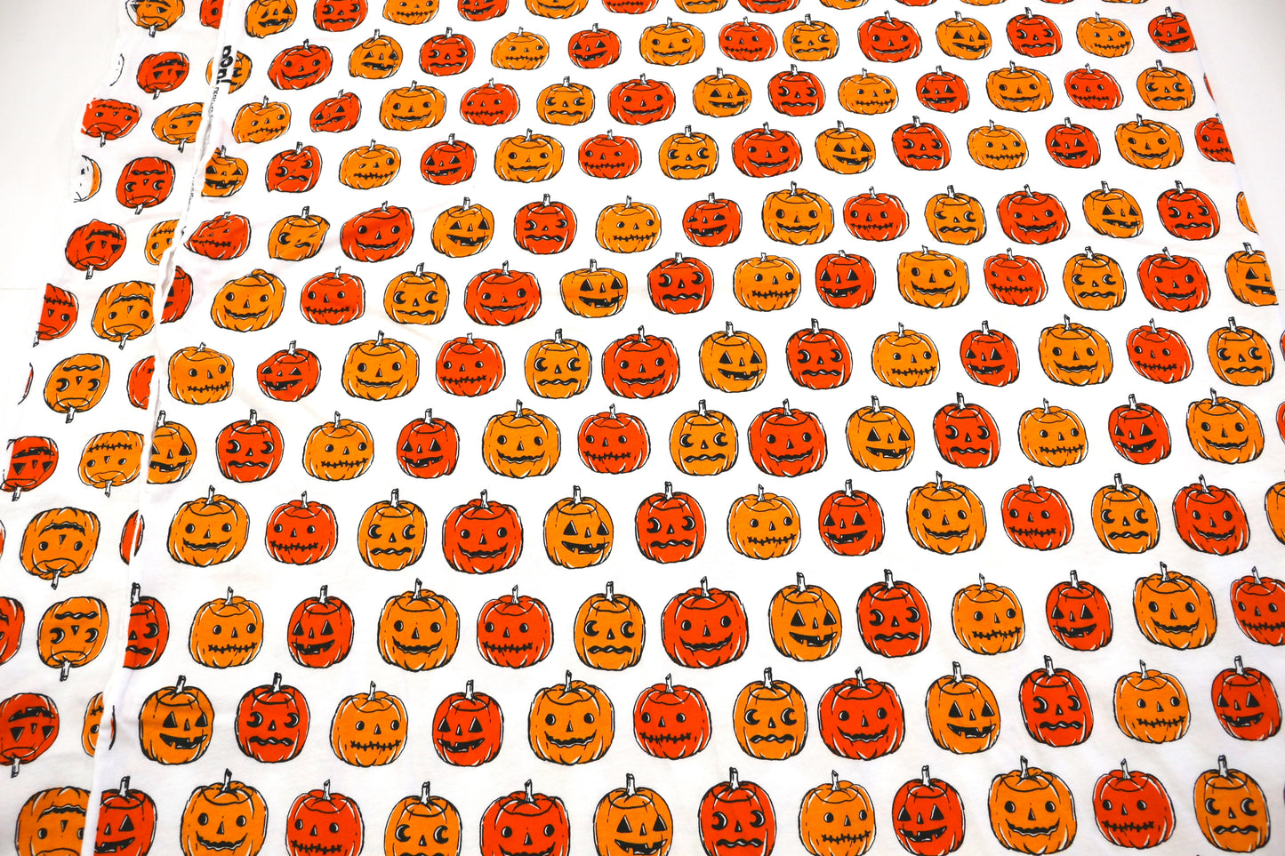 White Knit Fabric with Jack-O’-Lanterns – 57" x 2.25 Yards
