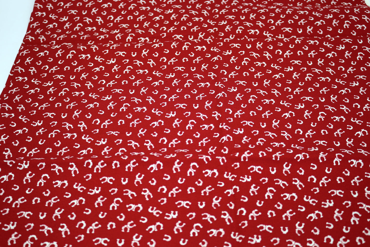 Horse Shoes on Red – Quilting Cotton Fabric – 44" x 1 Yard