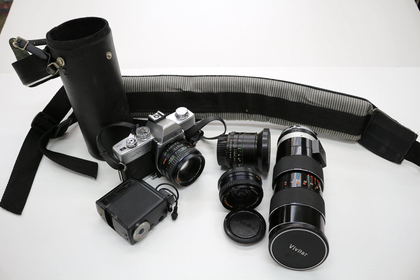 Minolta SRT SC-II 35mm Camera with 4 Lenses & Strap – Untested