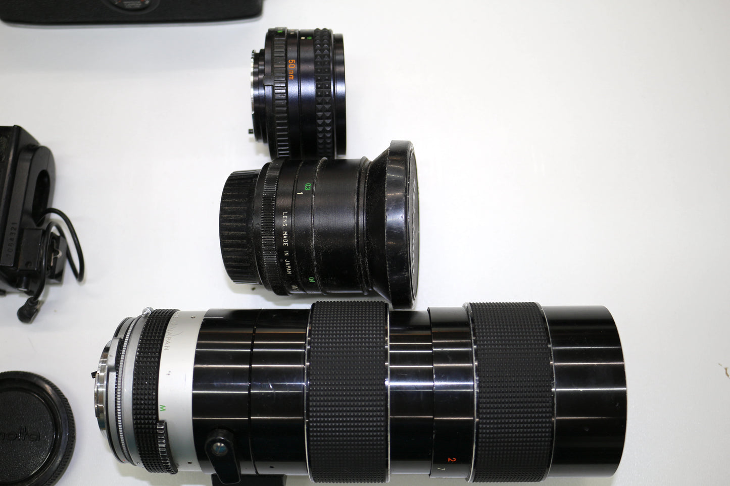Minolta SRT SC-II 35mm Camera with 4 Lenses & Strap – Untested