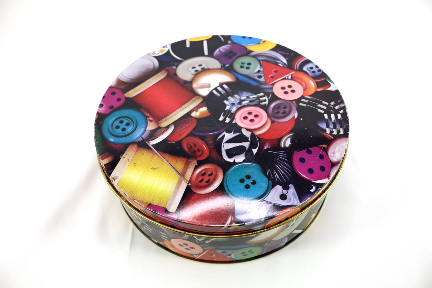 Button Tin filled with a Variety of Shoelaces