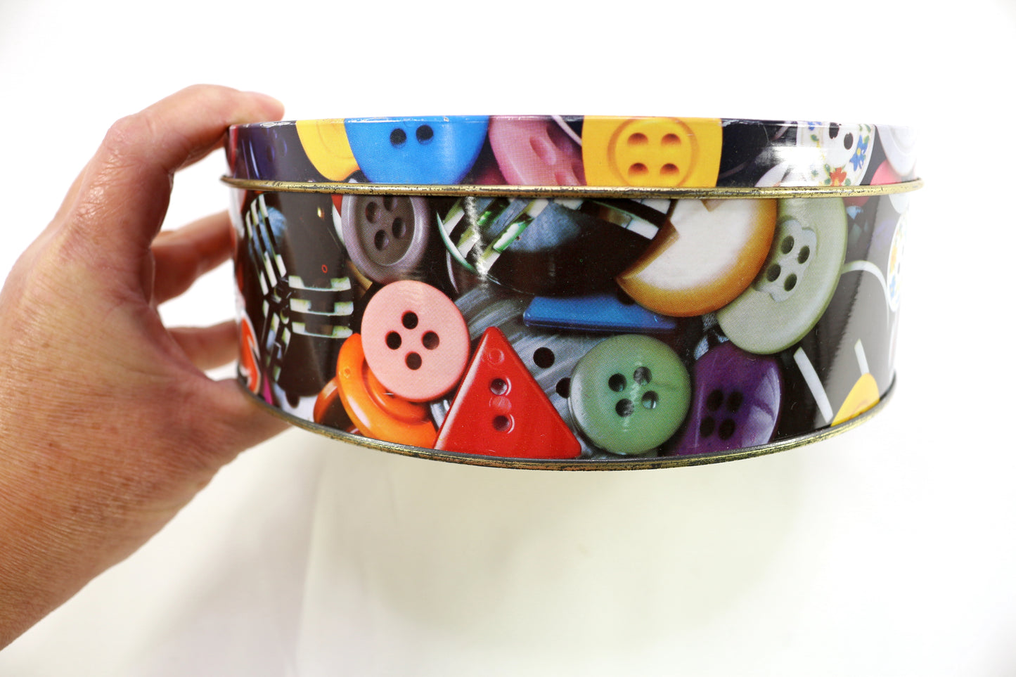 Button Tin filled with a Variety of Shoelaces
