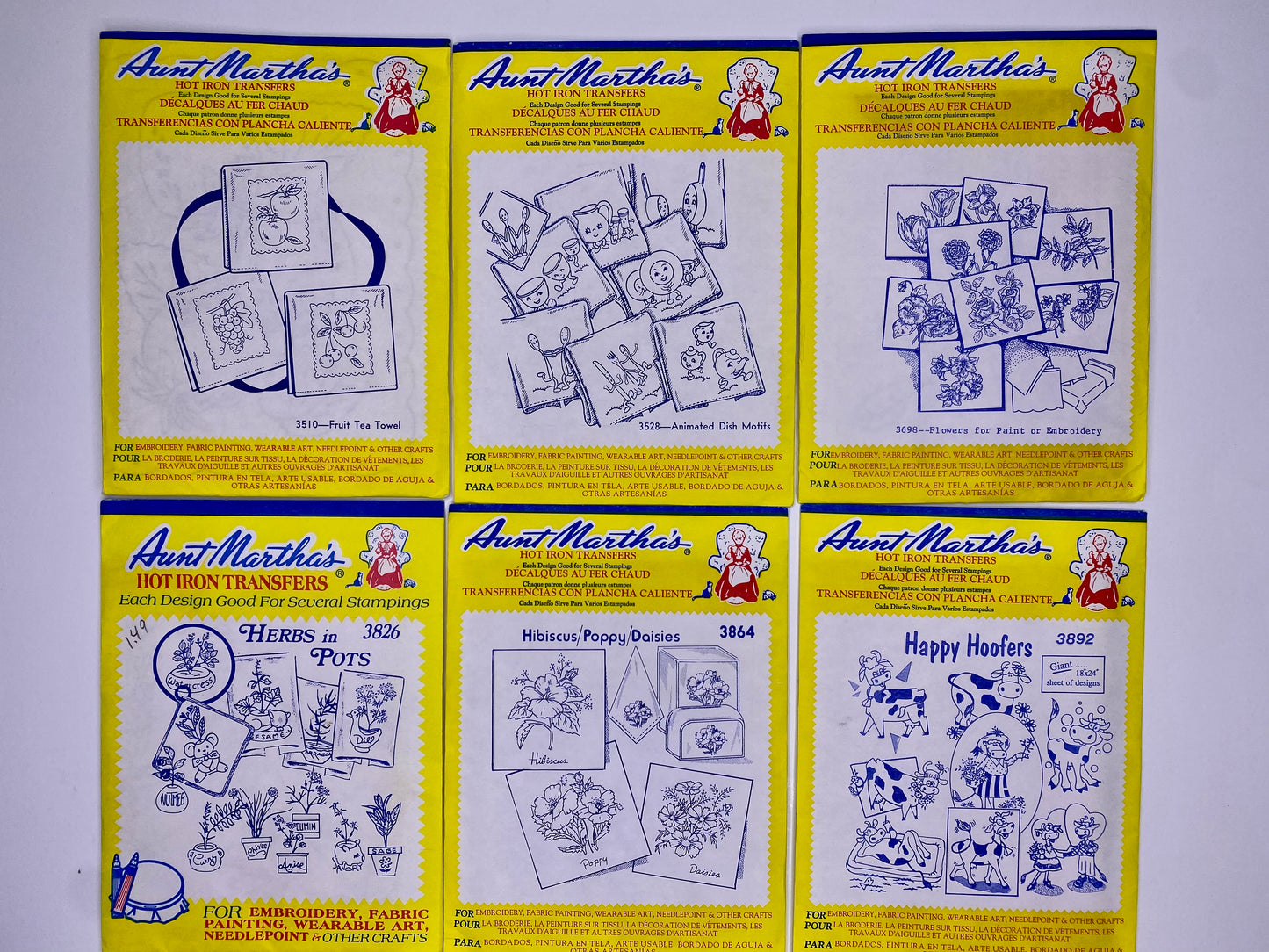 Aunt Martha's Hot Iron Transfers #3510 Fruit Tea Towel, #3826 Herbs in Pots, #3528 Animated Dish Motifs, #3864 Hibiscus/Poppy/Daisies, #3698 Flowers, #3892 Happy Hoofers