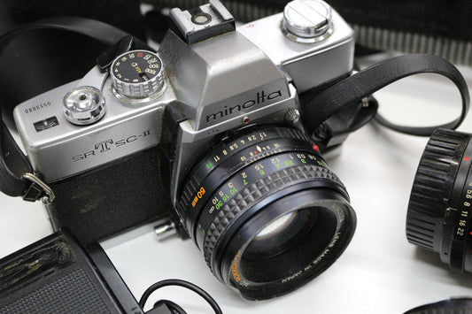 Minolta SRT SC-II 35mm Camera with 4 Lenses & Strap – Untested