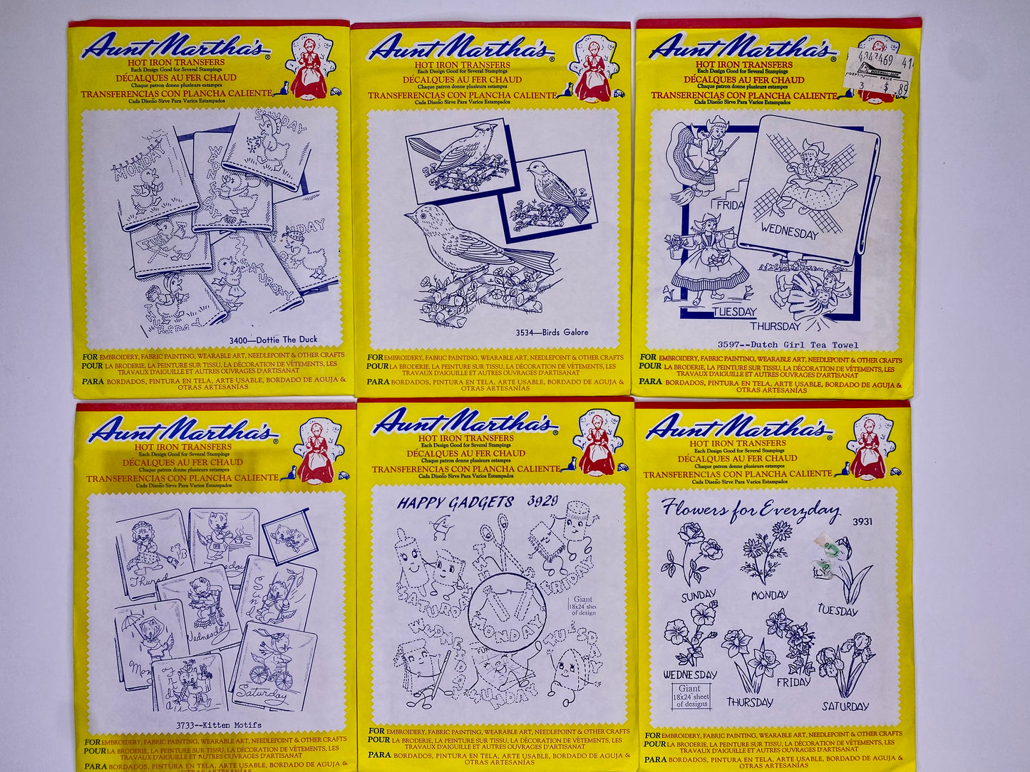 Aunt Martha's Hot Iron Transfers #3400 Dottie the Duck, #3733 Kitten Motifs, #3534 Birds Galore, #3929 Happy Gadgets, #3597 Dutch Girl Tea Towel, #3931 Flowers PK-28