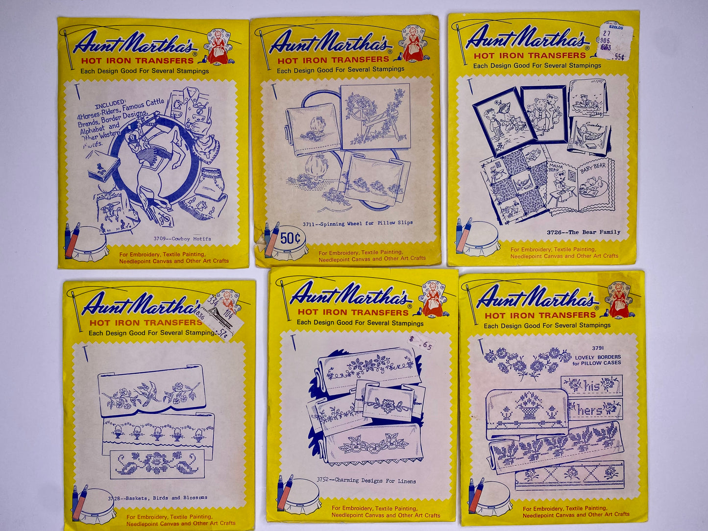 Aunt Martha's Hot Iron Transfers 3709 Cowboy Motifs, 3728 Baskets/ Birds/ Blossoms, 3711 Spinning Wheel, 3752 Charming Designs, 3726 Bear Family, 3791 Lovely Borders